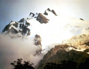 15 south american glacier peeking through the clouds at sunset in chile 800