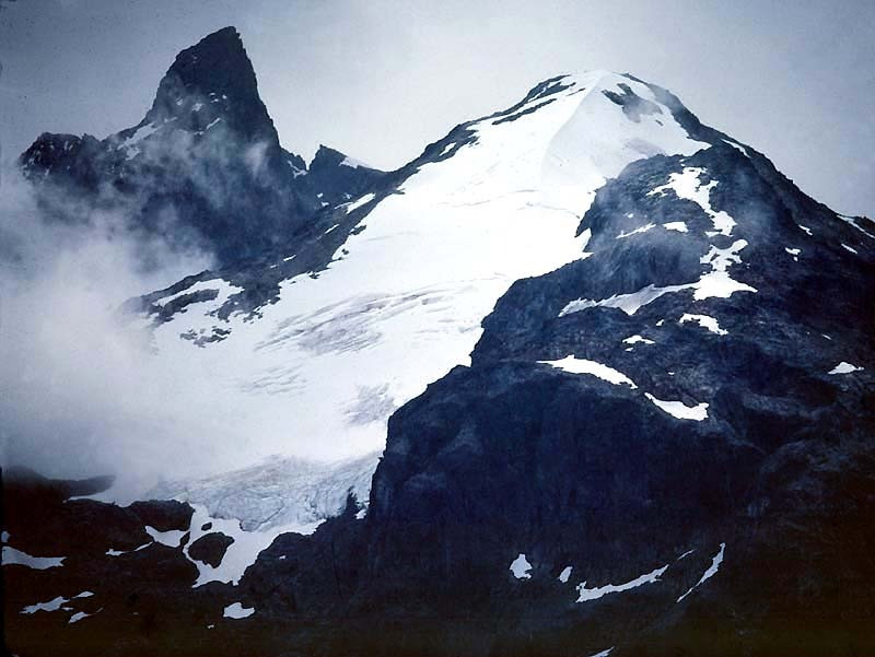 38 glacier peaking through the clouds in chile 800