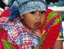 9 Guatemalan child getting a ride through the market place 800